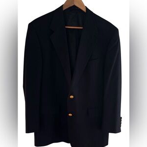 Men's classic navy blue blazer featuring gold buttons and soft wool blend.